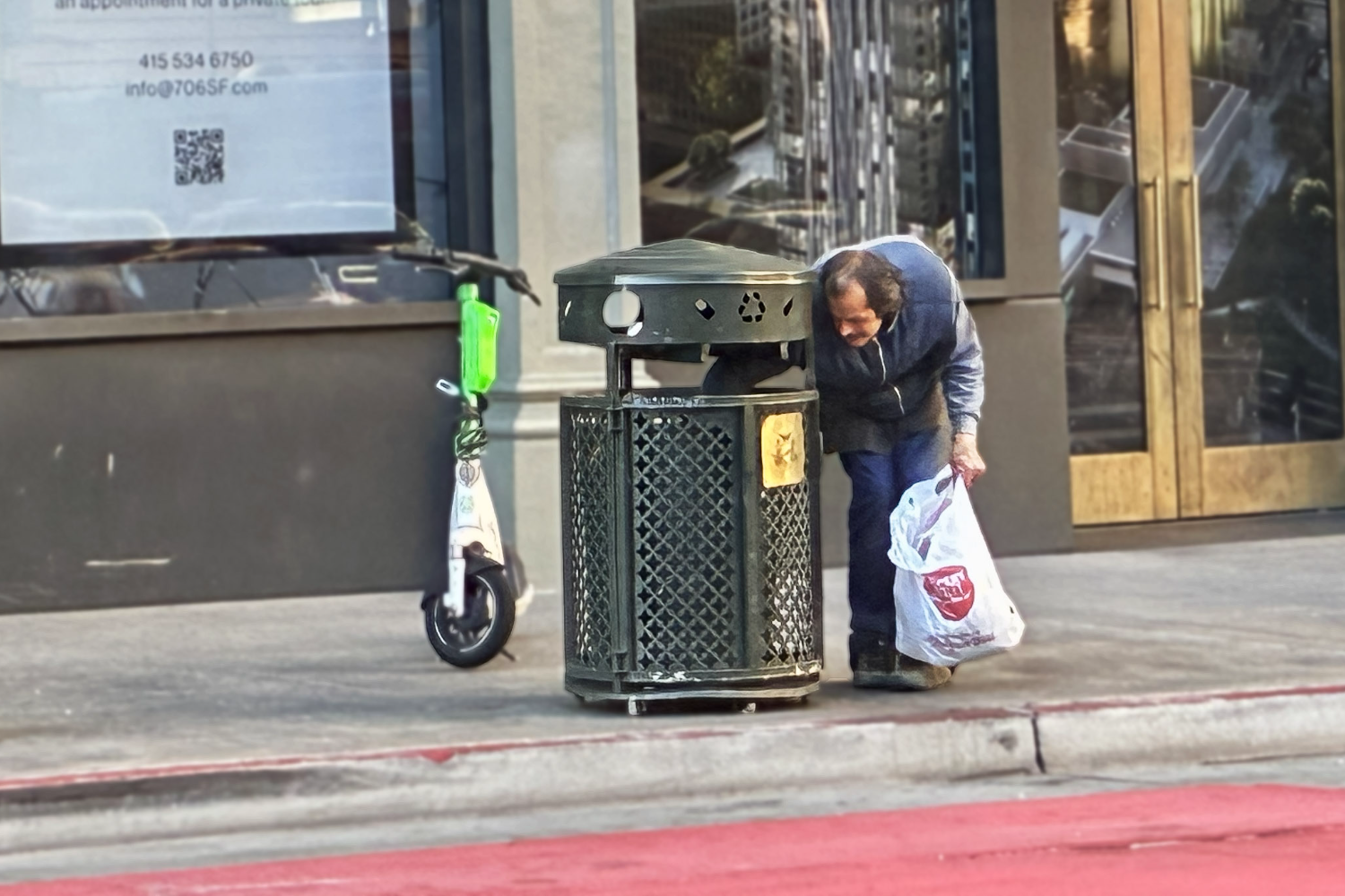 A homeless man in San Francisco digs through the trash can, pulling out an empty soda can. “I got to go find something, recycle cans, go do an odd job or something in order to have money,” said Eric Davis, a formerly homeless individual.