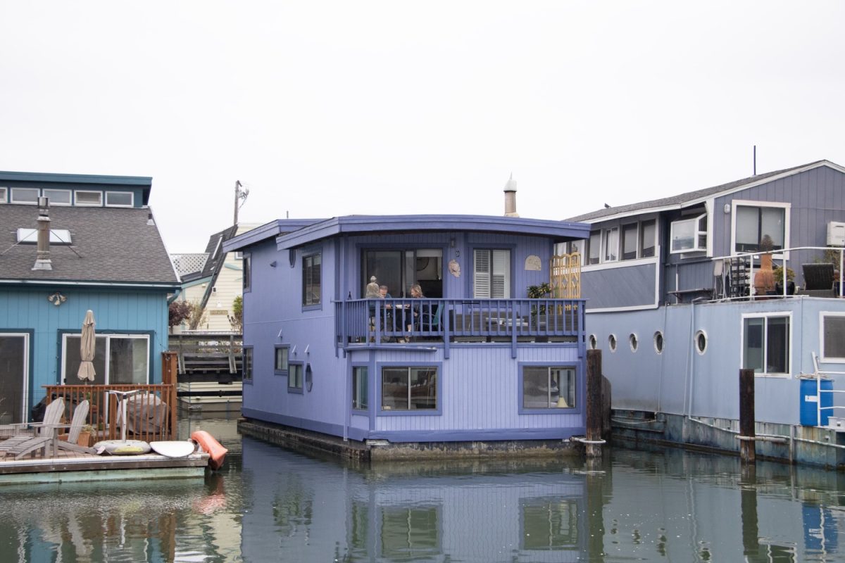 A family enjoys the light morning breeze as they eat their breakfast on the balcony of their floating home. Each of the Sausalito floating homes is unique in size and design, fitting the lifestyle of the resident who lives in it. 