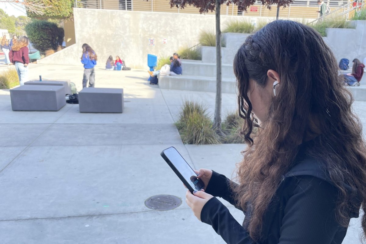 Absorbed in her phone, with her AirPods in, Shoshana Melon, a sophomore at Carlmont High School, appears busy and distracted. Melon wears headphones like many other teenagers. Daniel Ricci is a freshman at Northern Valley Regional High School at Demarest in New Jersey. “I usually have them in between periods, in class, if they let you, and if I'm going somewhere, like on a walk. So pretty much all the time,” Ricci said. 