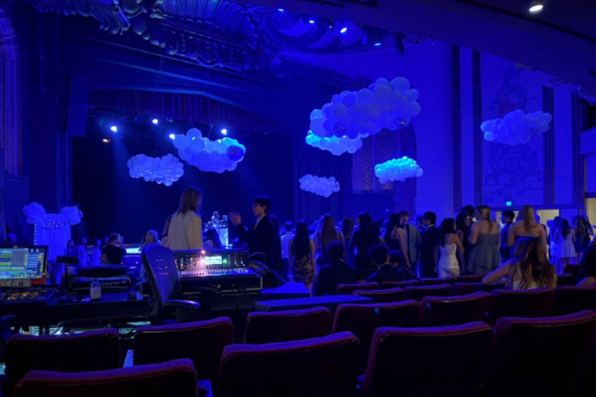 The "Cloud Nine" theme was shown through blue lighting and cloud-like balloon decorations around the venue, making the space feel bright, calm and special for Winter Formal. (Ethan Wong)