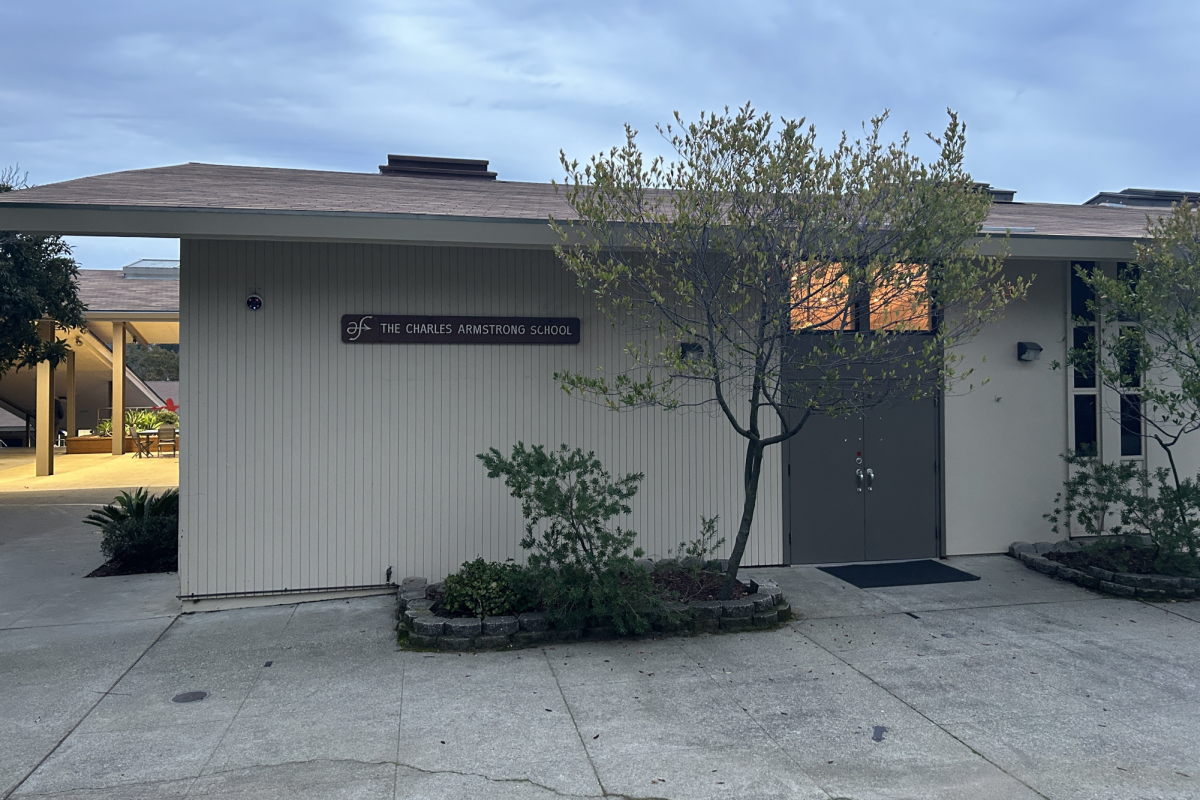 A sign on the building labels the Charles Armstrong School. The school is small with minimal capacity, located on 4.5 acres of campus space in a residential neighborhood.