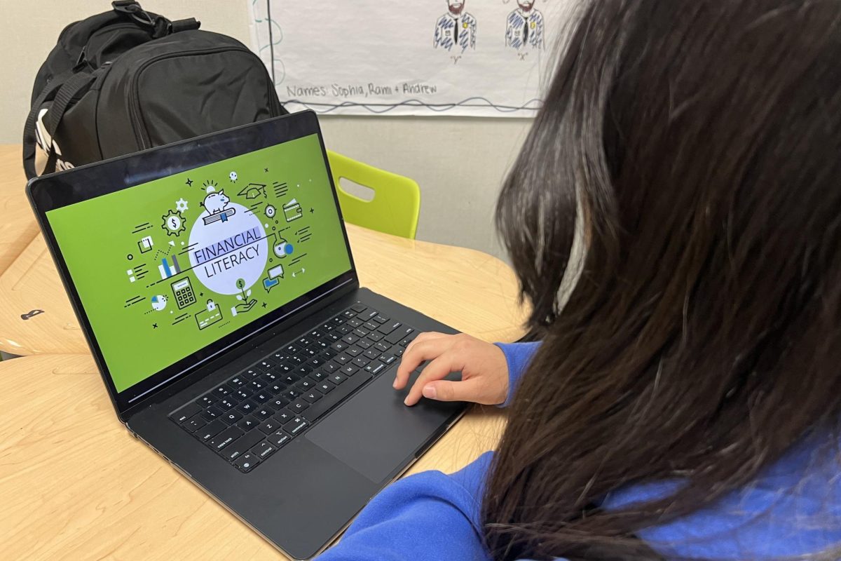 A Carlmont student explores online financial literacy programs, learning essential skills for managing money. Programs like these ensure that students are well prepared for financial responsibilities in the real world, after graduation.