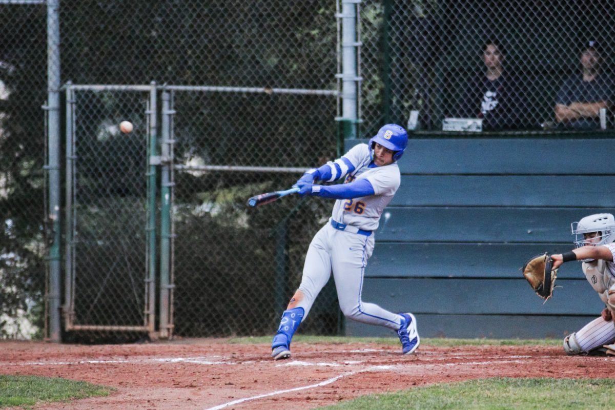 A Padre batter swings and connects with a pitch, sending it down the field. Offensively, the Padres were much more productive than the Scots during much of the game. "They had seen us play on Saturday when we beat them five to four, so they were coming out angry today," said Carlmont head coach Michael Simon.
