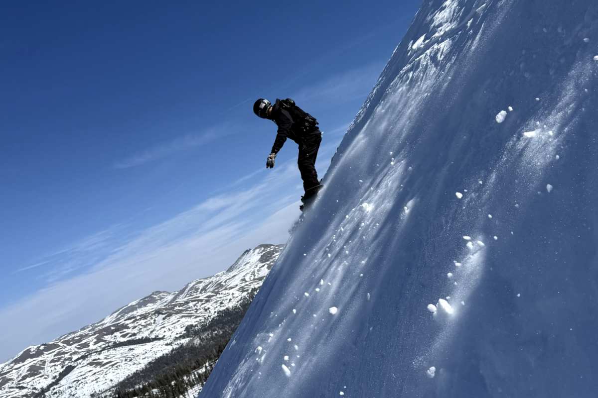 A snowboarder carves down a steep, powder-covered slope at Kirkwood Mountain Resort in Lake Tahoe. An earlier snowstorm had covered the face of the mountain with fresh snow, encouraging riders to go out into deceivingly dangerous conditions. Even so, local skiers and snowboarders were eager to experience the heavy snowfall.