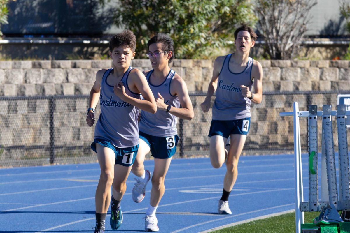 Scots freshman, Ethan Thomas, Wentao Rong, and Fyn Frazita run the 800-meter race on the track. The race tested both their speed and endurance as the runners pushed through two laps. “I was going to run a certain pace with the pack, but they went slower than I wanted, so it didn’t work out,” Frazita said.