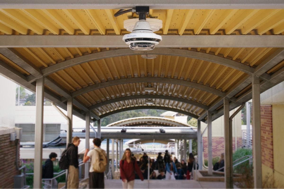 An Avigilon multisensor camera overlooks a covered walkway at Carlmont High School. These cameras are capable of AI-powered appearance tracking and can be licensed for facial recognition.