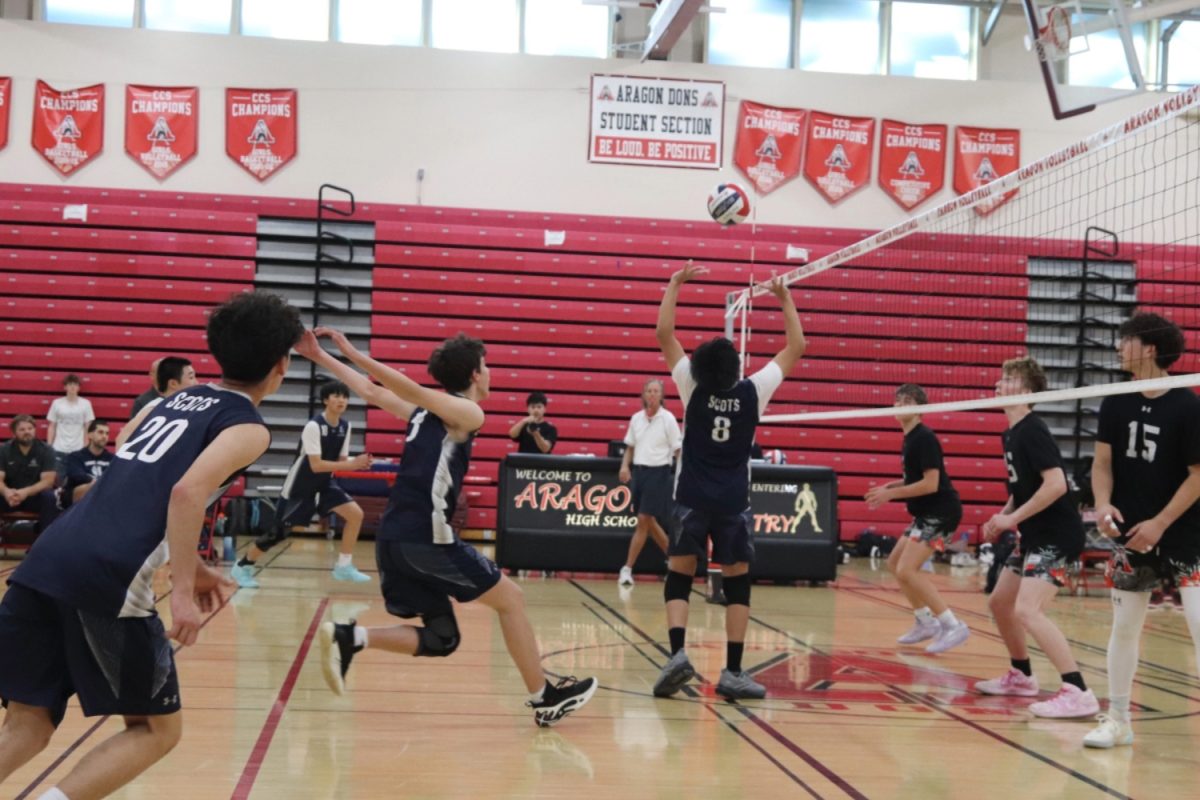Carlmont Sophomore Kyan Mayenkar sets the ball for freshman Daniel Vasilyev. The Aragon players stayed close to the net to get ready for the spike. The Scots made many similar plays throughout the game, which allowed them to catch up to Aragon later on in the first and second sets. 