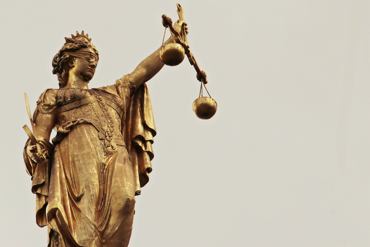Lady Justice holds a pair of scales, representing that an equal balance is guaranteed under rule of law. Similarly, the ruling against Donald Trump's tariffs signify the balance of power between the courts and the White House. 