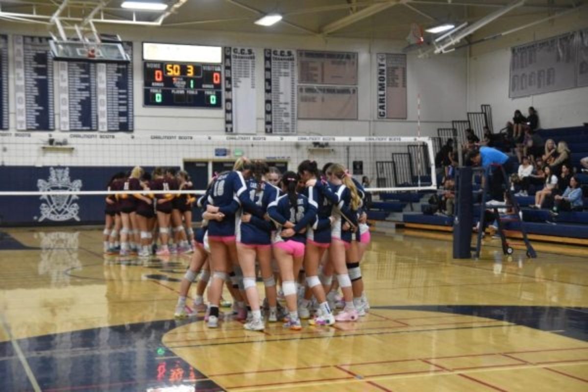 Carlmont volleyball players huddle during a game. Moments like this show the intensity and dedication behind girls sports, even when the stands aren’t full. Female athletes at Carlmont continue to compete with the same passion and drive as their male counterparts, pushing for equal recognition. 