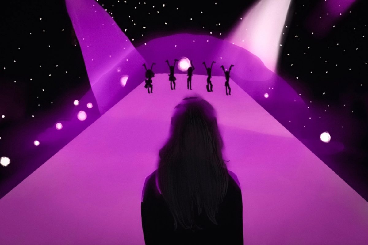 A shaded figure looks on as other group members perform onstage, mirroring Manon Bannerman's absence in KATSEYE's activities. The global girl group's performance at Coachella attracted over 60,000 spectators, according to The Chosun Daily.