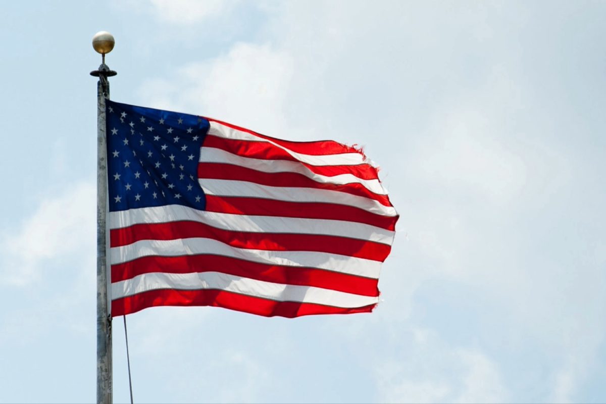 An American flag waves in the breeze, representing the values of the country. Although some may harbor concerns about the recent legislation concerning the Selective Service System, others such as Carlmont history teacher Jarrod Harrison believe otherwise. "I think many people are concerned about this because of the current war in Iran and the current President's threats to make war with other countries of Greenland and Cuba and the Panama canal.  I do not see a draft on the horizon and I can see the logic of making registration for selective service automatic as a way to be more efficient," Harrison said. 