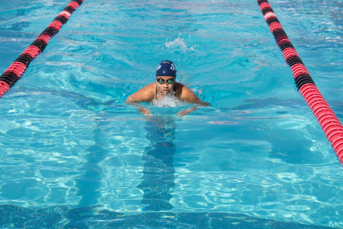 Carlmont freshman Sienna Lee swims in her 100-meter individual medley where she completed four strokes in butterfly, backstroke, breaststroke, and freestyle.  To prepare for the meet, the team made sure to practice turns and starts which helped Lee unexpectedly reach a personal record. "I took a week off for spring break and I didn't think I was going to PR or anything," Lee said.   