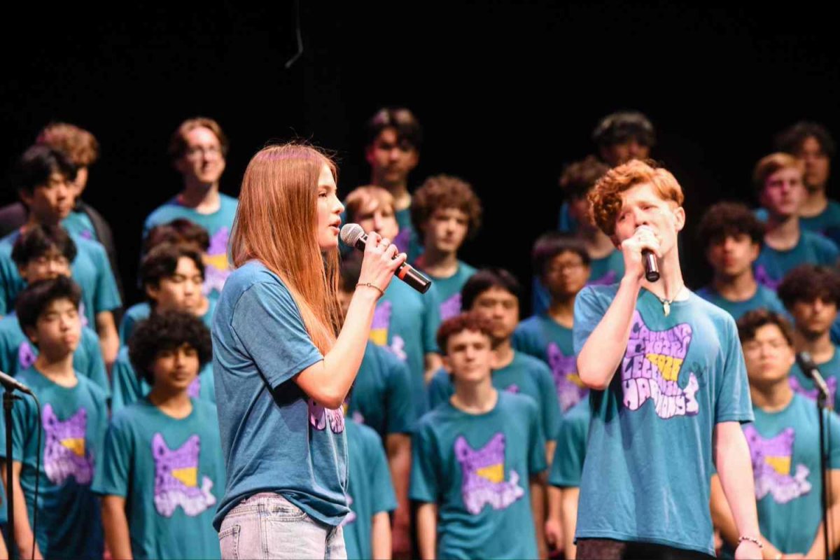 Adelyn Castelli and Nathan Conley sing a duet during the performance of "As the Ship Went Down." This was during the final section of the concert, performed by the Singing Scots, which is made up of all four choirs combined. Duets like this one required an audition, and students had to be selected for them depending on choir teacher Genevieve Tep's decision.  