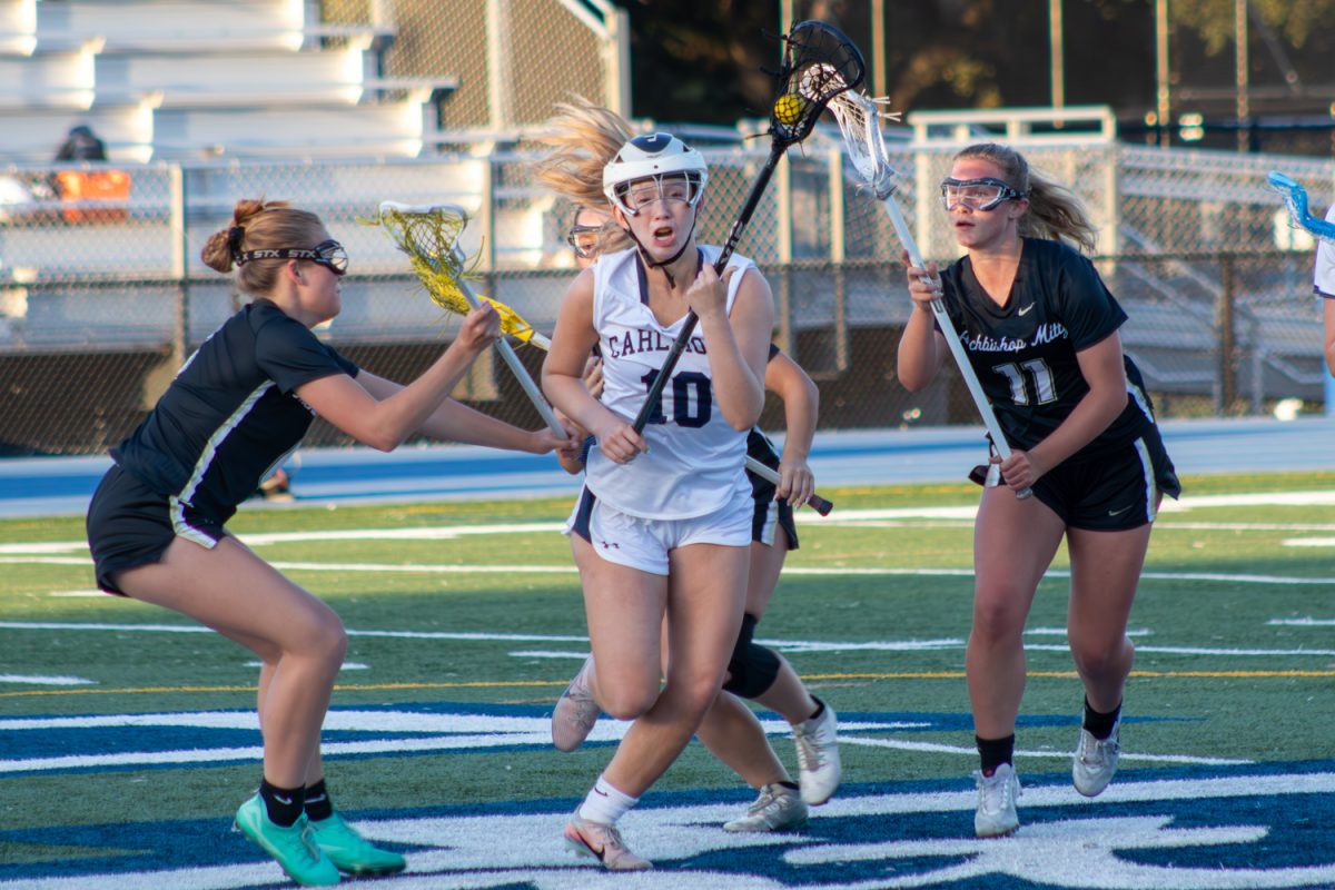 Senior Lauren Greene runs down the field while Monarchs players follow closely behind. Greene was an essential part of the Scots strategy and helped her teammates lead their attack. Greene was unable to score, but kept high intensity throughout the game.