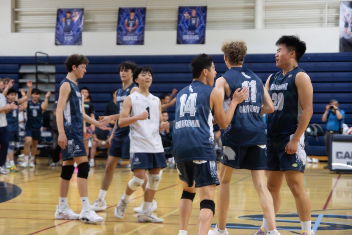 The Scots celebrate on the court after winning their last set. The players gathered together, smiling, as the crowd cheered. "I think the team dynamic today was electric. We were having a laugh on the sideline while watching all the plays," Meeks said.