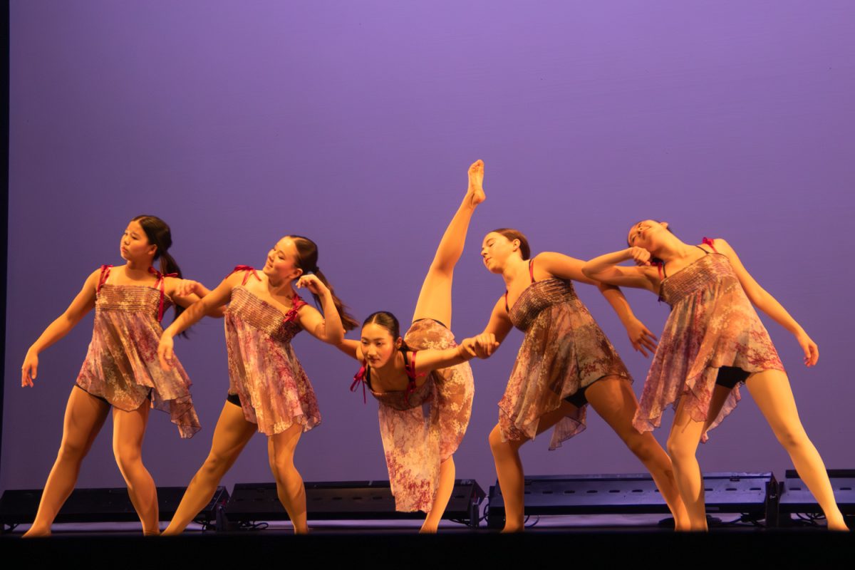 The Advanced Dance program gracefully move in sync in line with each other. This performance was a student-choreographed dance, created by senior Olive Burton. They danced to "Alone Again" by Gilbert O'Sullivan. "I can't believe it's been four years that I've stuck with it, I've really enjoyed it," Burton said. 