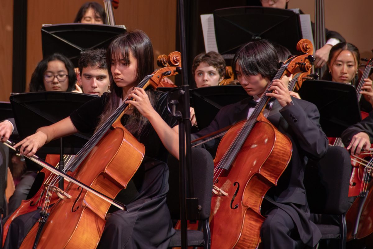 Athena Vernon and Rocky Lee play cello during Gustav Holst’s “The Planets,” specifically “Mars, the Bringer of War.” Both won awards for their outstanding skills. “I’ll be honest, for the entire time it was a blur, I was just focused on my music, and I think overall the performance went really well,” Lee said. 